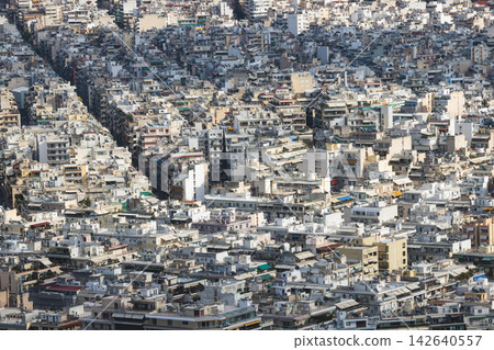 Athens, Attica, Greece, beautiful panoramic view of Athens cityscape, with The Parthenon, mountains, sea and scenery beyond the city, seen from Mount Lycabettus Hill observation deck in a sunny day 142640557
