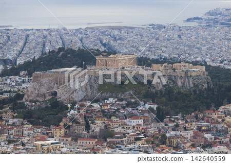 Athens, Attica, Greece, beautiful panoramic view of Athens cityscape, with The Parthenon, mountains, sea and scenery beyond the city, seen from Mount Lycabettus Hill observation deck in a sunny day Athens, Attica, Greece, beautiful panoramic view of Athens cityscape, with The Parthenon, mountains, sea and scenery beyond the city, seen from Mount Lycabettus Hill observation deck in a sunny day 142640559