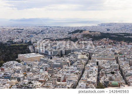 Athens, Attica, Greece, beautiful panoramic view of Athens cityscape, with The Parthenon, mountains, sea and scenery beyond the city, seen from Mount Lycabettus Hill observation deck in a sunny day 142640563