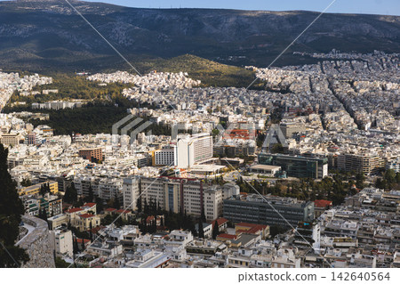 Athens, Attica, Greece, beautiful panoramic view of Athens cityscape, with The Parthenon, mountains, sea and scenery beyond the city, seen from Mount Lycabettus Hill observation deck in a sunny day Athens, Attica, Greece, beautiful panoramic view of Athens cityscape, with The Parthenon, mountains, sea and scenery beyond the city, seen from Mount Lycabettus Hill observation deck in a sunny day 142640564