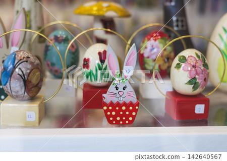 Easter in Greece, caffe and shop decorations, bunnies, multicoloured easter eggs, decorated shopwindow, Easter gifts and souvenirs, showcase, glass case, shopfront decorated in Athens, Attica, Greece Easter in Greece, caffe and shop decorations, bunnies, multicoloured easter eggs, decorated shopwindow, Easter gifts and souvenirs, showcase, glass case, shopfront decorated in Athens, Attica, Greece 142640567