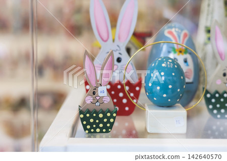 Easter in Greece, caffe and shop decorations, bunnies, multicoloured easter eggs, decorated shopwindow, Easter gifts and souvenirs, showcase, glass case, shopfront decorated in Athens, Attica, Greece Easter in Greece, caffe and shop decorations, bunnies, multicoloured easter eggs, decorated shopwindow, Easter gifts and souvenirs, showcase, glass case, shopfront decorated in Athens, Attica, Greece 142640570