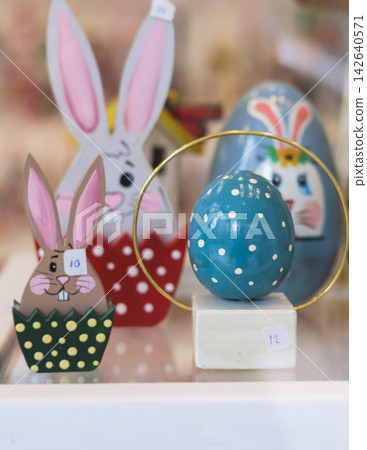 Easter in Greece, caffe and shop decorations, bunnies, multicoloured easter eggs, decorated shopwindow, Easter gifts and souvenirs, showcase, glass case, shopfront decorated in Athens, Attica, Greece Easter in Greece, caffe and shop decorations, bunnies, multicoloured easter eggs, decorated shopwindow, Easter gifts and souvenirs, showcase, glass case, shopfront decorated in Athens, Attica, Greece 142640571