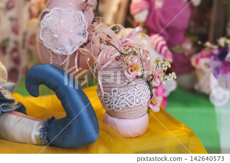 Easter in Greece, caffe and shop decorations, bunnies, multicoloured easter eggs, decorated shopwindow, Easter gifts and souvenirs, showcase, glass case, shopfront decorated in Athens, Attica, Greece Easter in Greece, caffe and shop decorations, bunnies, multicoloured easter eggs, decorated shopwindow, Easter gifts and souvenirs, showcase, glass case, shopfront decorated in Athens, Attica, Greece 142640573