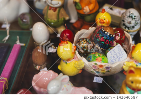 Easter in Greece, caffe and shop decorations, bunnies, multicoloured easter eggs, decorated shopwindow, Easter gifts and souvenirs, showcase, glass case, shopfront decorated in Athens, Attica, Greece Easter in Greece, caffe and shop decorations, bunnies, multicoloured easter eggs, decorated shopwindow, Easter gifts and souvenirs, showcase, glass case, shopfront decorated in Athens, Attica, Greece 142640587