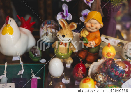 Easter in Greece, caffe and shop decorations, bunnies, multicoloured easter eggs, decorated shopwindow, Easter gifts and souvenirs, showcase, glass case, shopfront decorated in Athens, Attica, Greece Easter in Greece, caffe and shop decorations, bunnies, multicoloured easter eggs, decorated shopwindow, Easter gifts and souvenirs, showcase, glass case, shopfront decorated in Athens, Attica, Greece 142640588