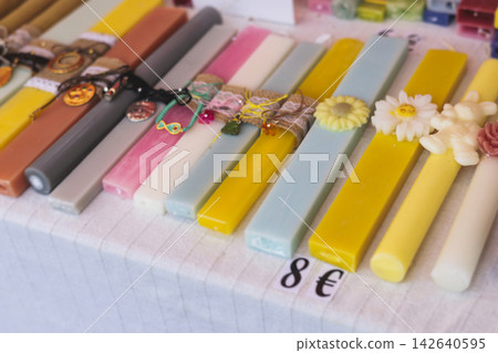 Greek Easter candles, assortment selection of handmade crafted traditional lambada, multicoloured wax candles with ribbon for sale in local store market, Orthodox Easter traditions in Athens, Greece Greek Easter candles, assortment selection of handmade crafted traditional lambada, multicoloured wax candles with ribbon for sale in local store market, Orthodox Easter traditions in Athens, Greece 142640595