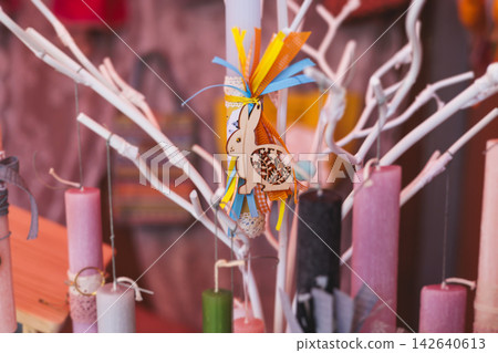 Greek Easter candles, assortment selection of handmade crafted traditional lambada, multicoloured wax candles with ribbon for sale in local store market, Orthodox Easter traditions in Athens, Greece Greek Easter candles, assortment selection of handmade crafted traditional lambada, multicoloured wax candles with ribbon for sale in local store market, Orthodox Easter traditions in Athens, Greece 142640613
