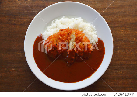 Chicken cutlet curry rice viewed from directly above the table background. Chicken cutlet curry rice viewed from directly above the table background. 142641377
