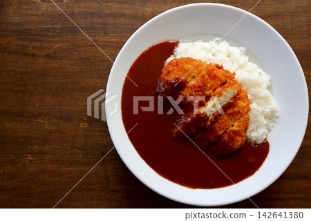 Chicken cutlet curry rice viewed from directly above the table background. Chicken cutlet curry rice viewed from directly above the table background. 142641380