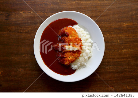 Chicken cutlet curry rice viewed from directly above the table background. Chicken cutlet curry rice viewed from directly above the table background. 142641383