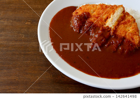 Chicken cutlet curry rice in the background of the table 142641498