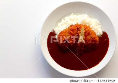 Chicken cutlet curry rice viewed from directly above against a white background. Chicken cutlet curry rice viewed from directly above against a white background. 142641696