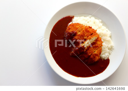 Chicken cutlet curry rice viewed from directly above against a white background. Chicken cutlet curry rice viewed from directly above against a white background. 142641698
