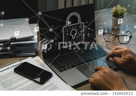 Businessman using a laptop with digital padlock  142642013
