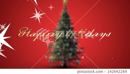 Featuring evergreen tree with ornaments, lights on red backdrop, showing gold Happy holidays Featuring evergreen tree with ornaments, lights on red backdrop, showing gold Happy holidays 142642269