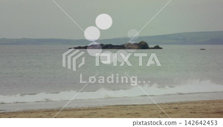 Showing centered rocky islet and calm sea surface at shoreline, featuring loading spinner Loading Showing centered rocky islet and calm sea surface at shoreline, featuring loading spinner Loading 142642453