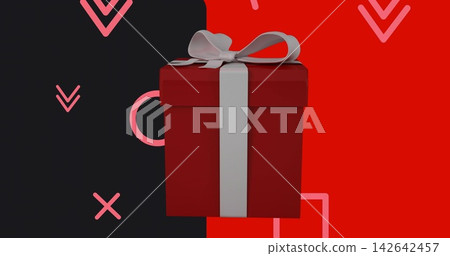 Displaying red square gift box sitting centered on split-color studio backdrop, with white ribbon 142642457