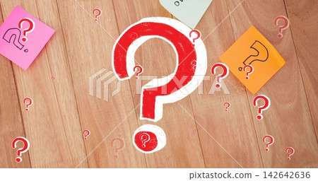 Displaying red-white ? mark centered on wood desk, cutouts, pink left, orange right, pale green top Displaying red-white ? mark centered on wood desk, cutouts, pink left, orange right, pale green top 142642636