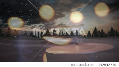 Standing figure wearing red hat and coat on pond in snowy field with pines, snowfall, bokeh Standing figure wearing red hat and coat on pond in snowy field with pines, snowfall, bokeh 142642710