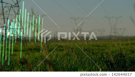 Capturing foreground tall grasses swaying on rural plain near power pylons, with turquoise overlay 142644037