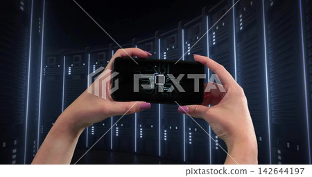Holding hands and forearms framing smartphone at chest in curved racks, showing microchip and LEDs 142644197