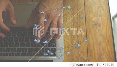 Typing hands with bare arms on laptop keyboard, trackpad on wooden table at home, social overlay 142644940