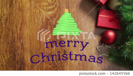 Displaying centered purple merry Christmas text with green tree on wooden table, with red gifts Displaying centered purple merry Christmas text with green tree on wooden table, with red gifts 142645566