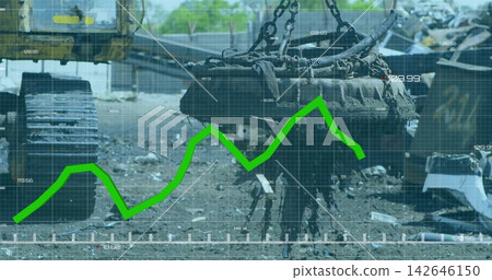 Hanging electromagnet dripping shredded metal in scrap yard, with chains, track, green graph 142646150