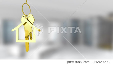 Hanging gold house-shaped keychain holding metal keys in staged flat, with circular metal key ring Hanging gold house-shaped keychain holding metal keys in staged flat, with circular metal key ring 142646359