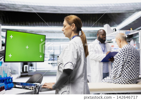Isolated screen on monitor with medic overseeing tests during a pharmacology trial, recording dosage levels and monitoring side effects. Results to ensure safety and healthcare innovation. Isolated screen on monitor with medic overseeing tests during a pharmacology trial, recording dosage levels and monitoring side effects. Results to ensure safety and healthcare innovation. 142646717