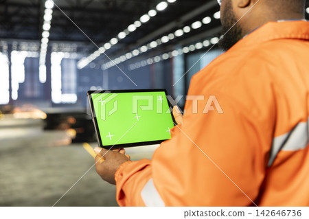 Isolated mockup with worker in industry plant overseeing manufacturing process with automation equipment, engineering skills and production accuracy. Heavy industrial operations. Isolated mockup with worker in industry plant overseeing manufacturing process with automation equipment, engineering skills and production accuracy. Heavy industrial operations. 142646736