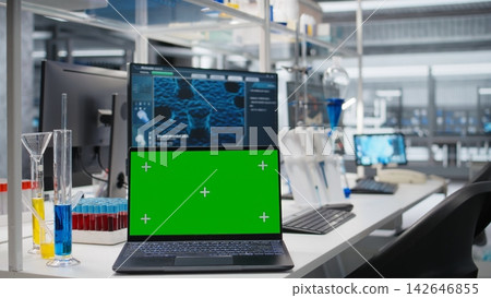 Green screen laptop and computer monitor in laboratory showing molecular model software used for research. Mockup notebook and PC in medical lab displaying DNA data, jib up shot Green screen laptop and computer monitor in laboratory showing molecular model software used for research. Mockup notebook and PC in medical lab displaying DNA data, jib up shot 142646855