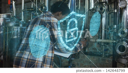 Inspecting Black technician in plaid noting clipboard data at plant, padlock fingerprint overlays Inspecting Black technician in plaid noting clipboard data at plant, padlock fingerprint overlays 142648799