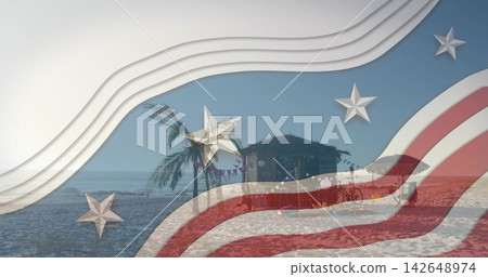 Showing thatched palapa with two palm trees standing on sandy shore near calm ocean, flag overlay Showing thatched palapa with two palm trees standing on sandy shore near calm ocean, flag overlay 142648974