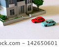 A model house and two cars 142650601