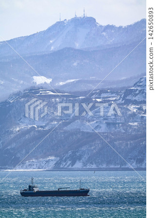 A ship sailing on the winter sea A ship sailing on the winter sea 142650893