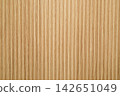 Textured vertical lines in warm hues form an inviting backdrop for spaces 142651049