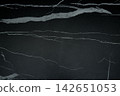 Dark marble surface showcases striking white veins, enhancing sophistication 142651053