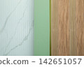 Vertical sections reveal smooth marble and warm wood textures 142651057