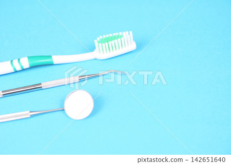 dentist tools with toothbrush mouth mirror oral health instruments and dental dentist tools with toothbrush mouth mirror oral health instruments and dental 142651640