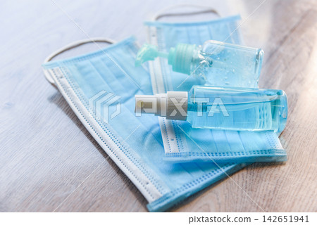 Face mask and product clean disinfectant kill virus bacteria germs hand sanitizer bottle gel for washing hands hygiene with alcohol gel and antibacterial soap sanitizer coronavirus prevention outbreak Face mask and product clean disinfectant kill virus bacteria germs hand sanitizer bottle gel for washing hands hygiene with alcohol gel and antibacterial soap sanitizer coronavirus prevention outbreak 142651941