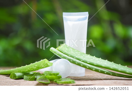 Fresh aloe vera plant leaf with gel on wooden natural herbs and herbal medicines cosmetic cream lotion aloe vera with nature green Fresh aloe vera plant leaf with gel on wooden natural herbs and herbal medicines cosmetic cream lotion aloe vera with nature green 142652051