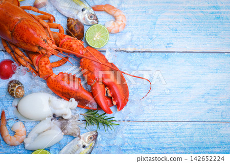 Fresh fish and seafood plate with Shellfish, Fresh raw seafood on ice at the fish market food Fresh fish and seafood plate with Shellfish, Fresh raw seafood on ice at the fish market food 142652224