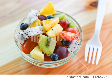 fresh fruit salad bowl - healthy food summer fruit and berries fresh fruit salad bowl - healthy food summer fruit and berries 142652232