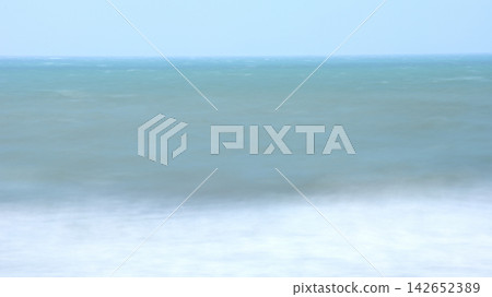 A turbulent sea and an ambiguous horizon, smoothly rendered with long exposure. A turbulent sea and an ambiguous horizon, smoothly rendered with long exposure. 142652389