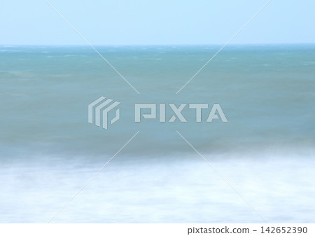 A turbulent sea and an ambiguous horizon, smoothly rendered with long exposure. A turbulent sea and an ambiguous horizon, smoothly rendered with long exposure. 142652390