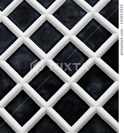 A landscape featuring the aesthetic design of namako-kabe, a traditional Japanese exterior wall finish. A landscape featuring the aesthetic design of namako-kabe, a traditional Japanese exterior wall finish. 142652933