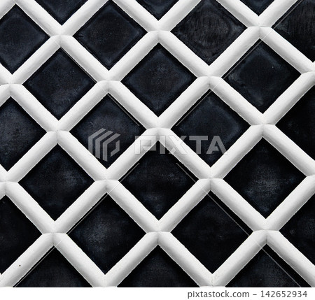 A landscape featuring the aesthetic design of namako-kabe, a traditional Japanese exterior wall finish. A landscape featuring the aesthetic design of namako-kabe, a traditional Japanese exterior wall finish. 142652934