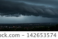A layer of gray clouds bringing rain 142653574